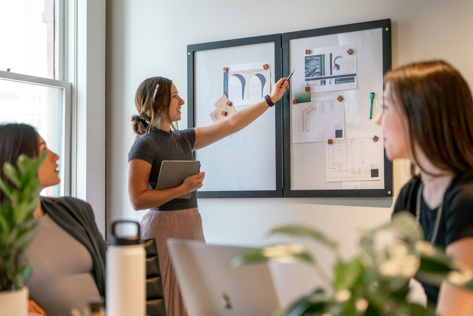 A team collaborating around a shared workspace