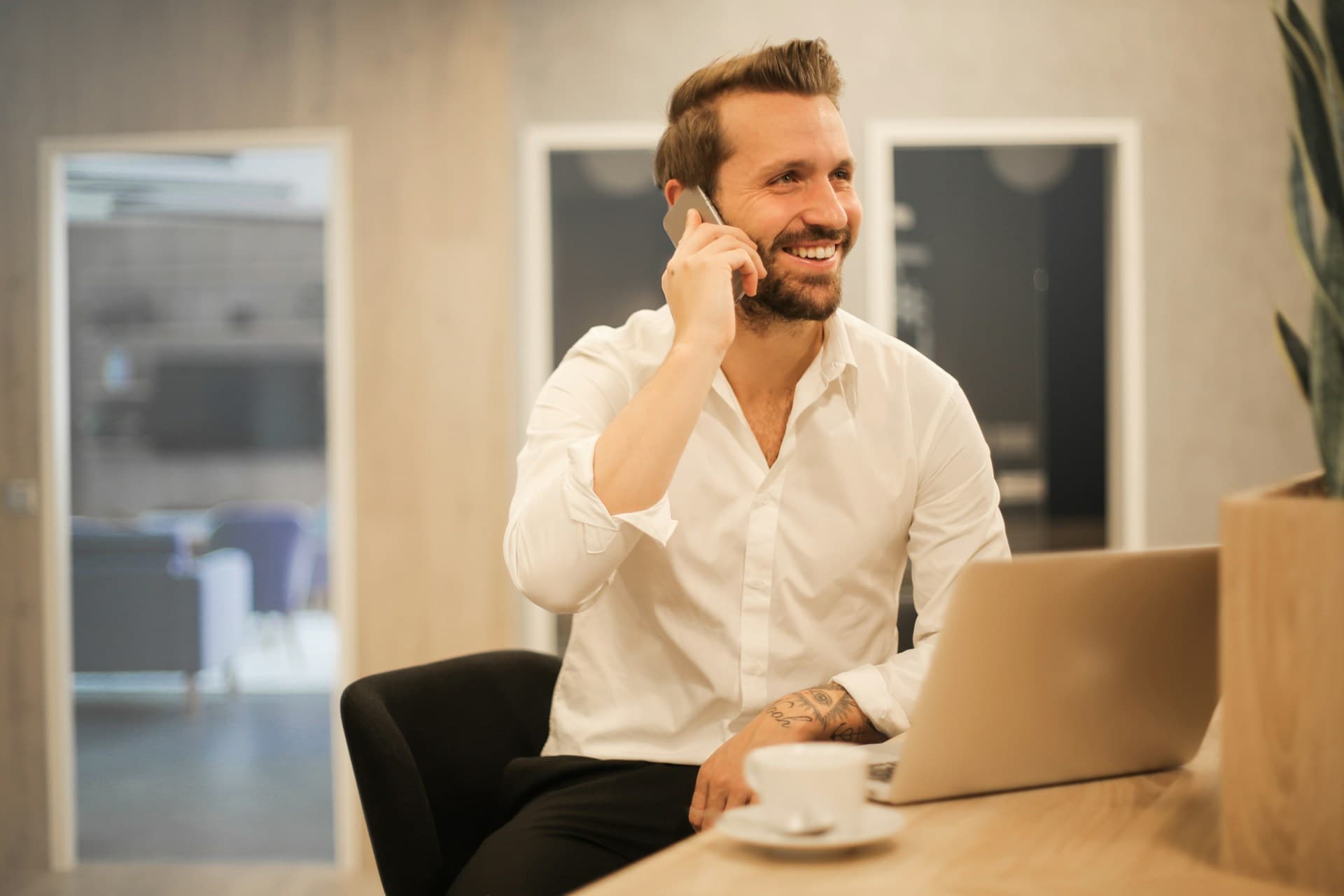 A business owner at a desk weighing important decisions