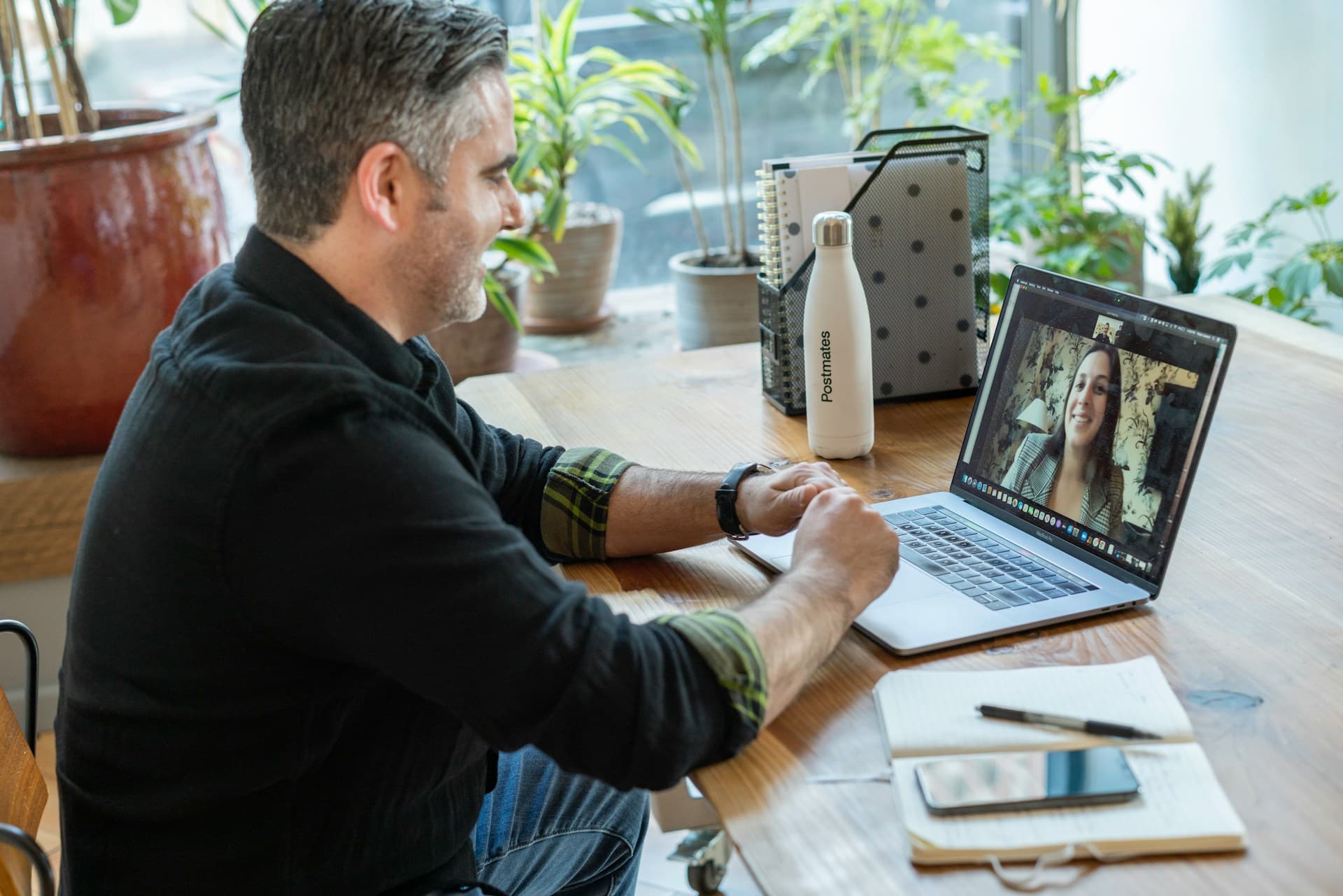 A professional assessment conversation taking place at a desk