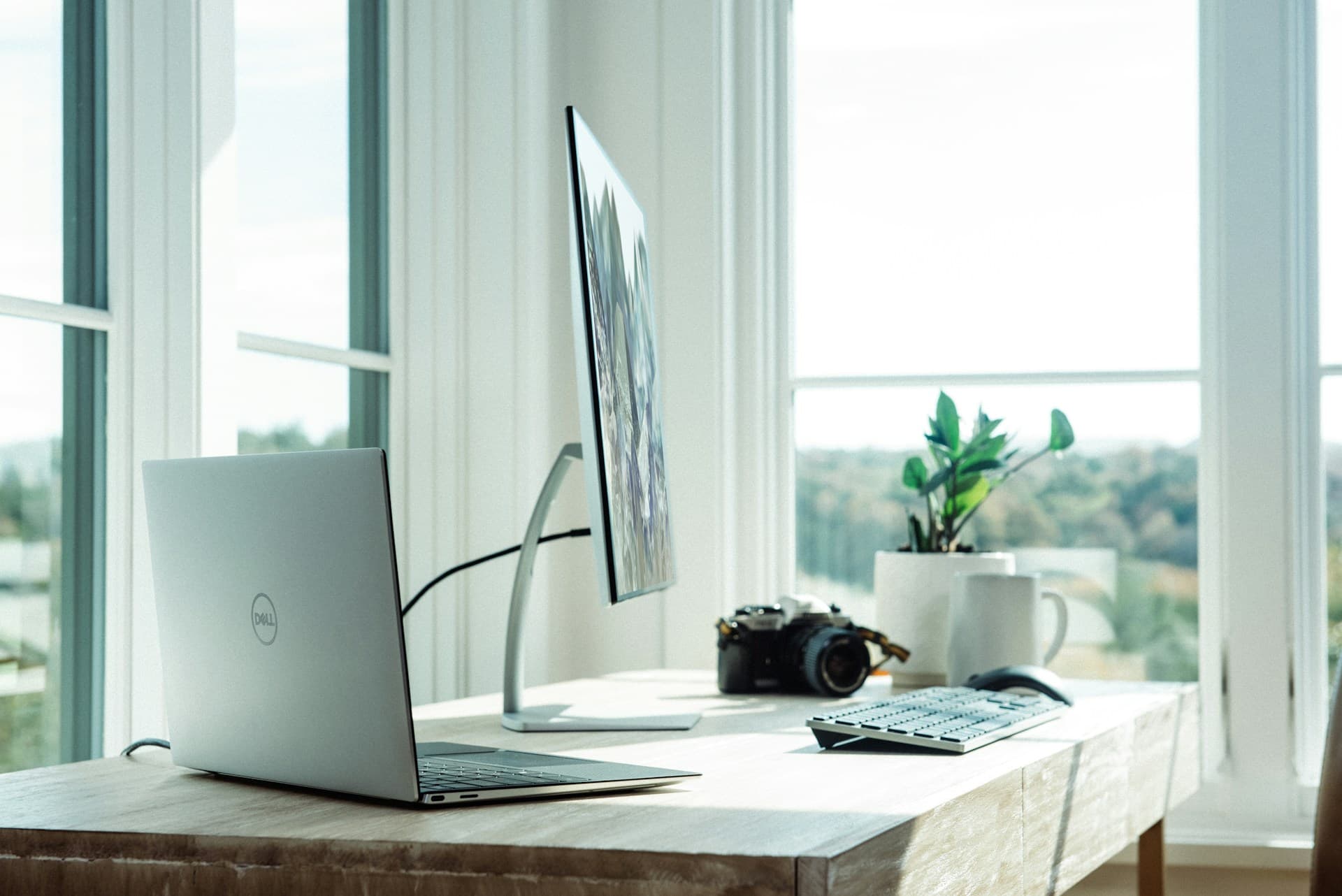 A self-employed professional working at a home office desk