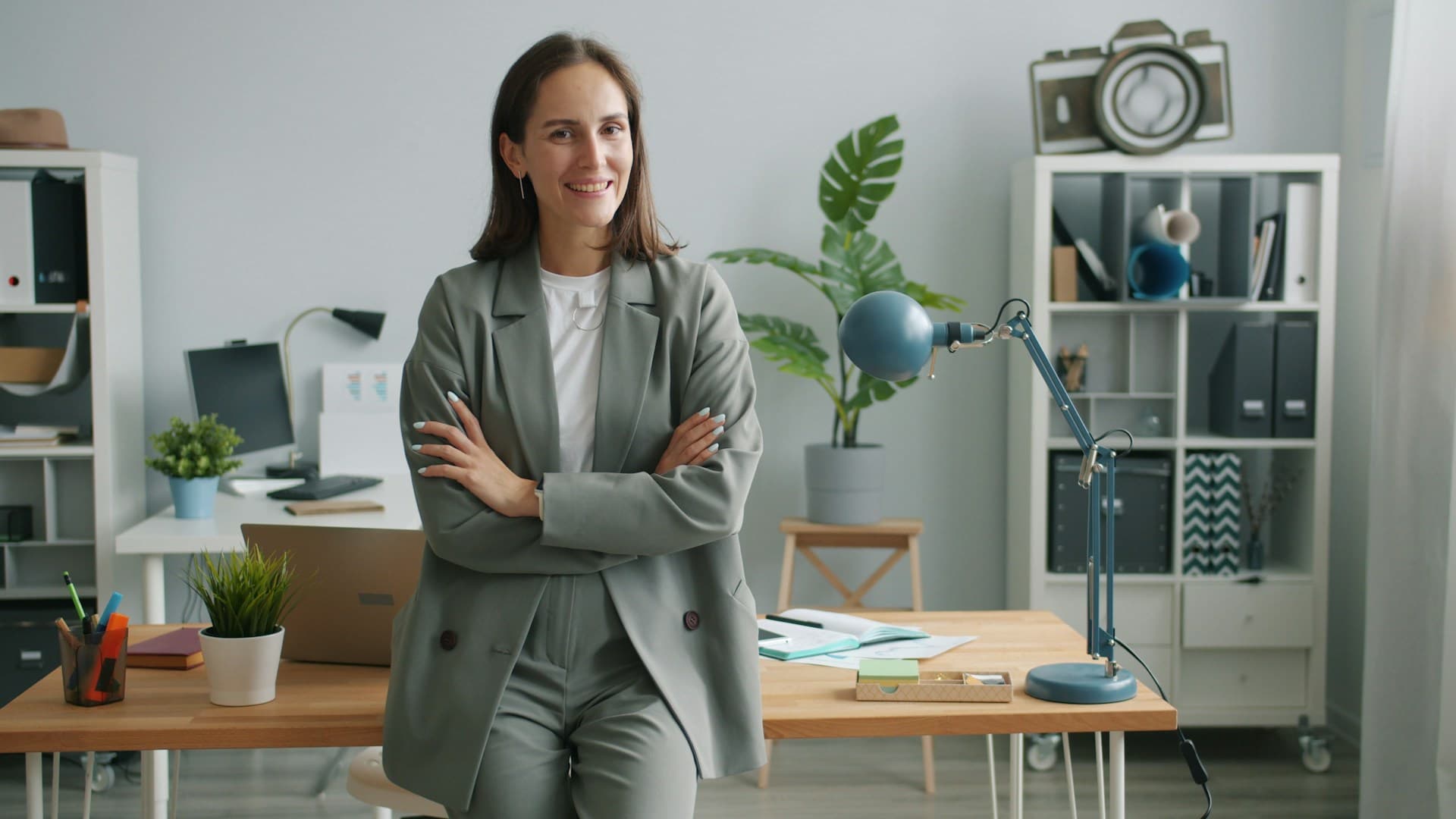 A confident business leader standing in a modern office