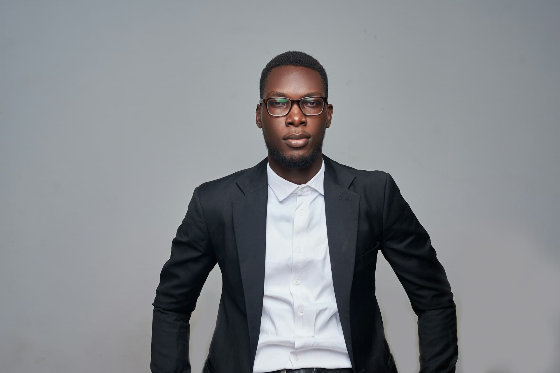 A professional business mentor in a suit and glasses